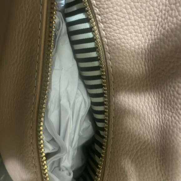 Pre-loved Kate Spade shoulder bag. Colors are fawn and black with gold accents. - Picture 8 of 9